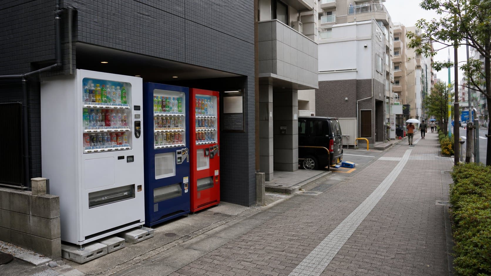 Several beverage vending machines integrated into an everyday Japanese neighborhood